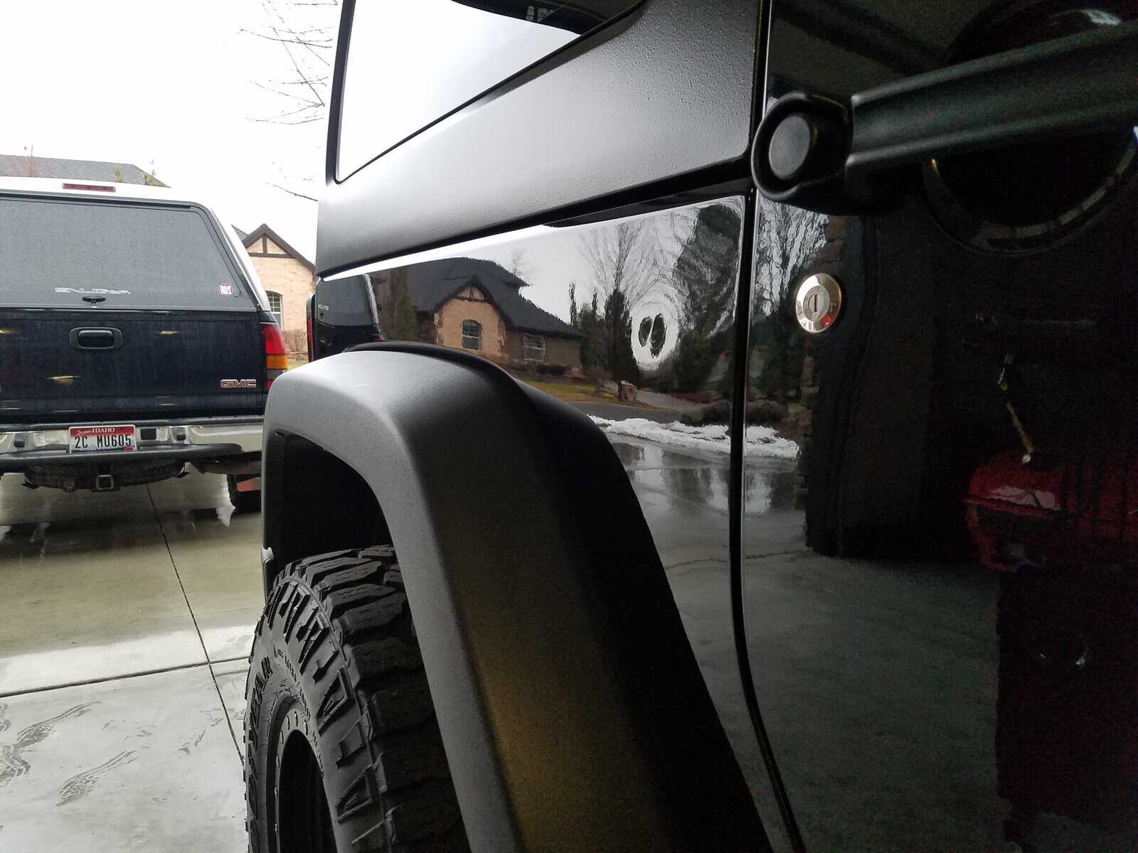 Door ding in quarter panel of Jeep Wrangler