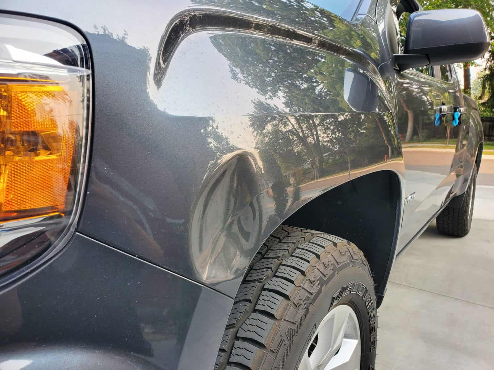 Deep and sharp body line auto body accident on GMC Canyon fender
