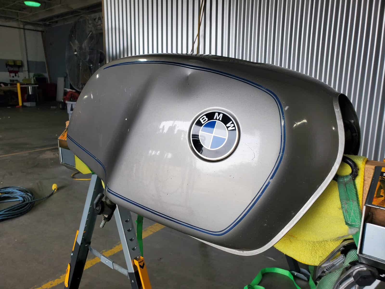 BMW Motorcycle tank with sharp deep dent