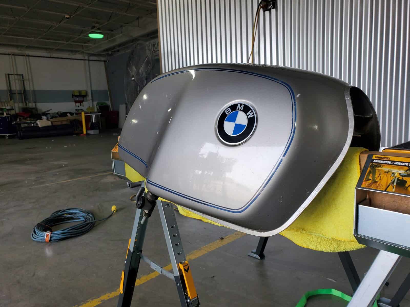 BMW Motorcycle tank with sharp deep dent repaired with paintless dent repair PDR