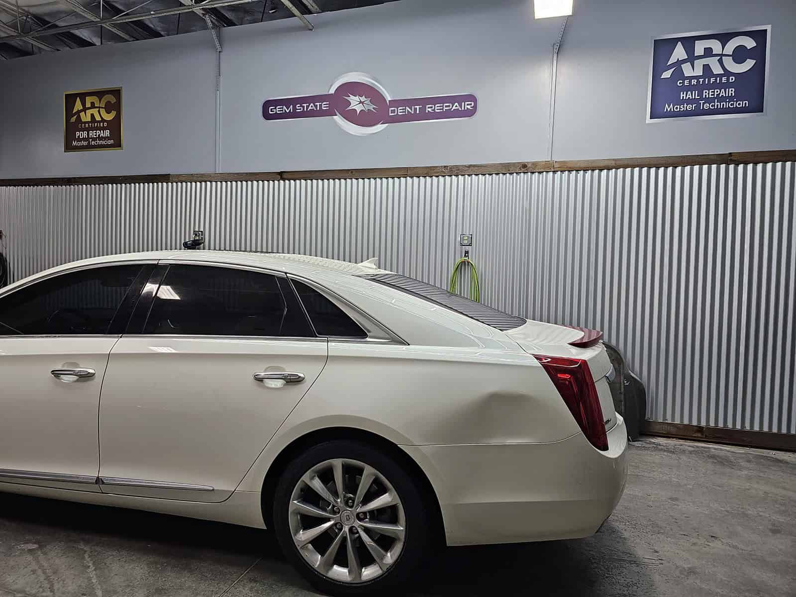 quarter panel autobody accident repaired with paintless dent removal PDR in Cadillac