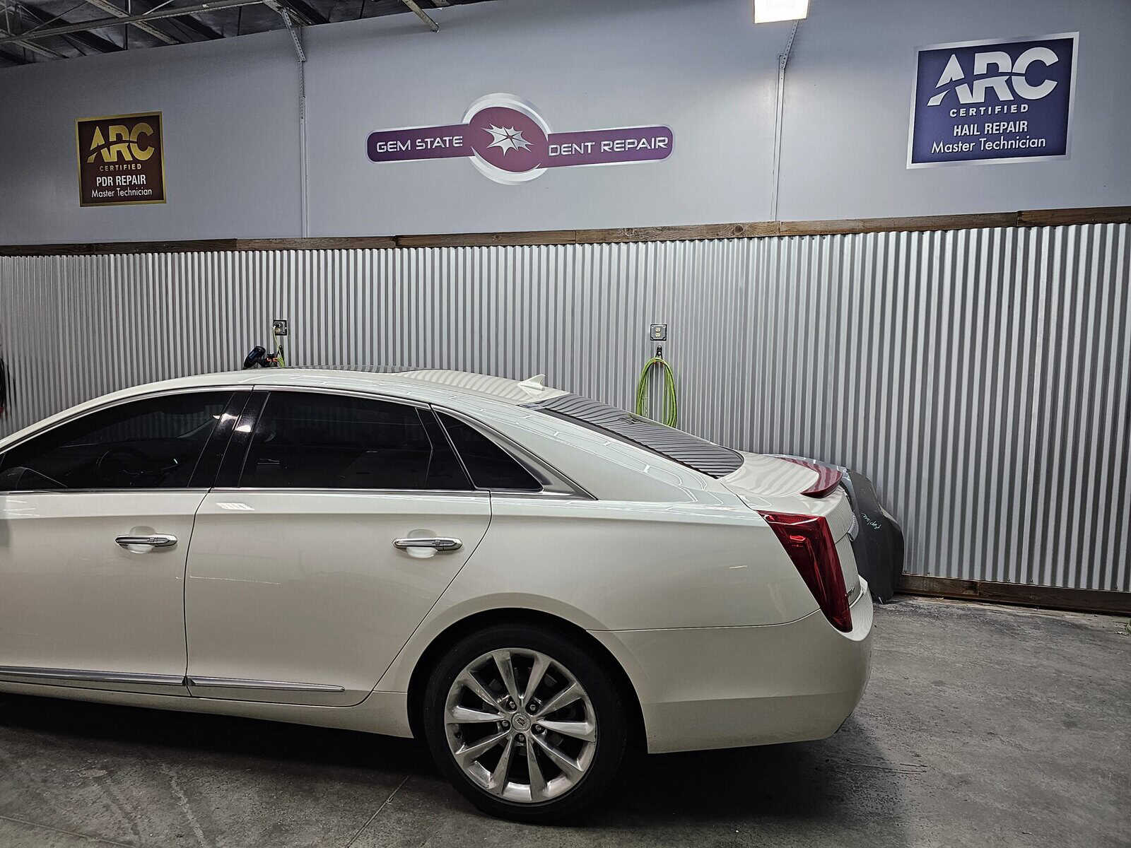 quarter panel autobody accident repaired with paintless dent removal PDR in Cadillac completed repair