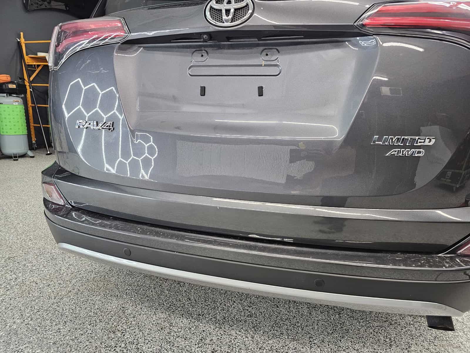 Sharp body line dent due to rear end in hatch of Toyota Rav4 restored using paintless dent repair PDR