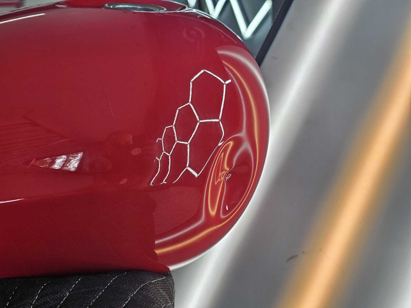 Extremely deep dent in Honda Fury motorcycle tank in process of being repaired