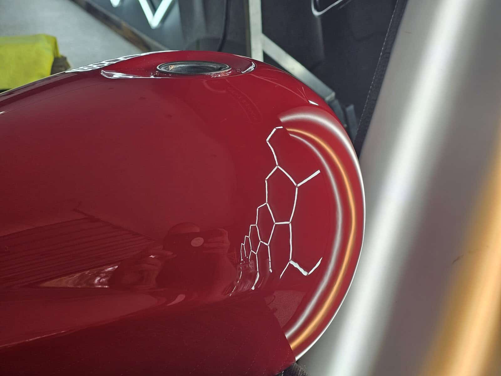 Extremely deep dent in Honda Fury motorcycle tank restored using paintless dent removal PDR