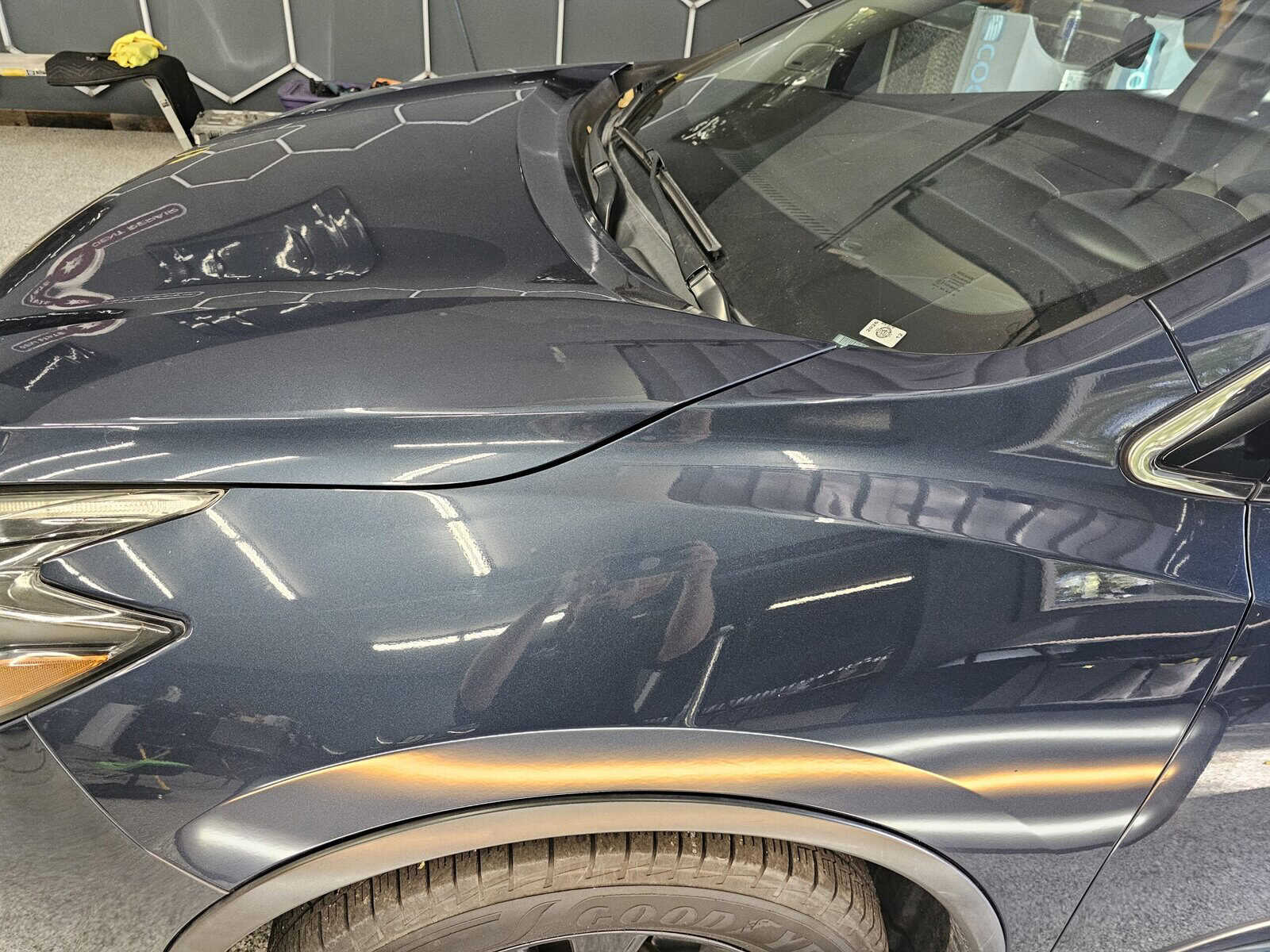 Autobody Collision damage in front fender of Nissan Murano repaired with autobody paintless dent repair PDR